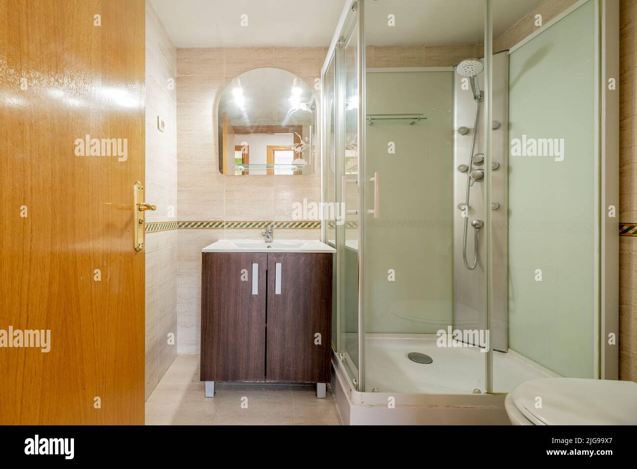 Bathroom of a house with shower cubicle with massage jets, frameless