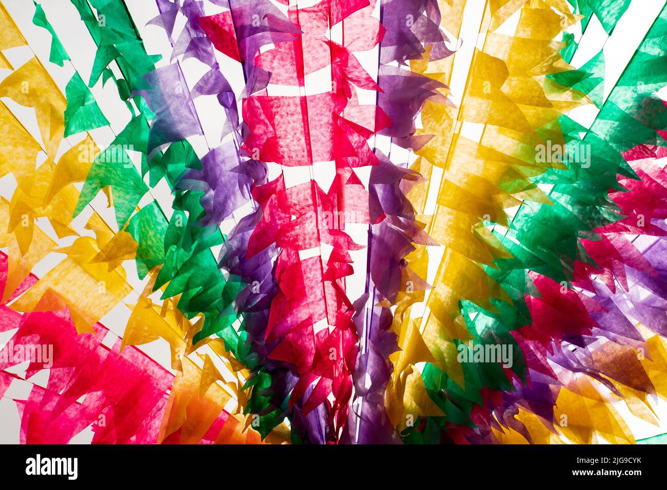 junina decoration - colorful moving flags with white background Stock Photo