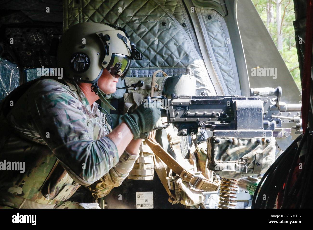 Sgt. Christopher Hill, a Soldier assigned to 2nd Battalion, 3rd General Support Aviation Battalion, 3rd Combat Aviation Brigade, 3rd Infantry Division, shoots a M240H Machine Gun during aerial gunnery at Fort Stewart, Georgia, July 6, 2022. Aerial gunnery tests air crews' weapon proficiency, and improves overall unit readiness. (U.S. Army photo by Spc. Caitlin Wilkins, 3rd Combat Aviation Brigade) Stock Photo