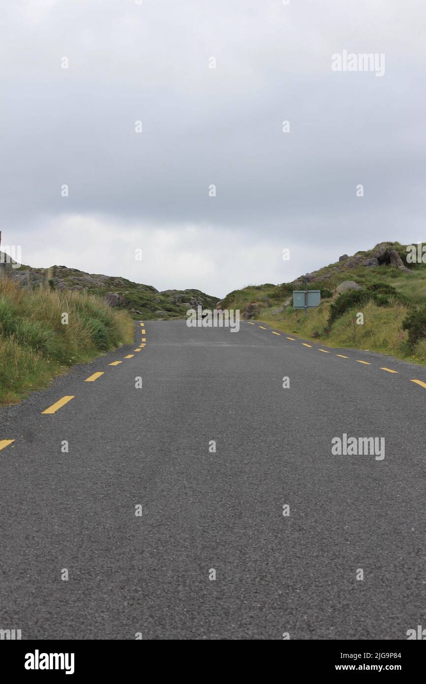 Narrow, winding road on Valentia Island, County Kerry, Ireland Stock