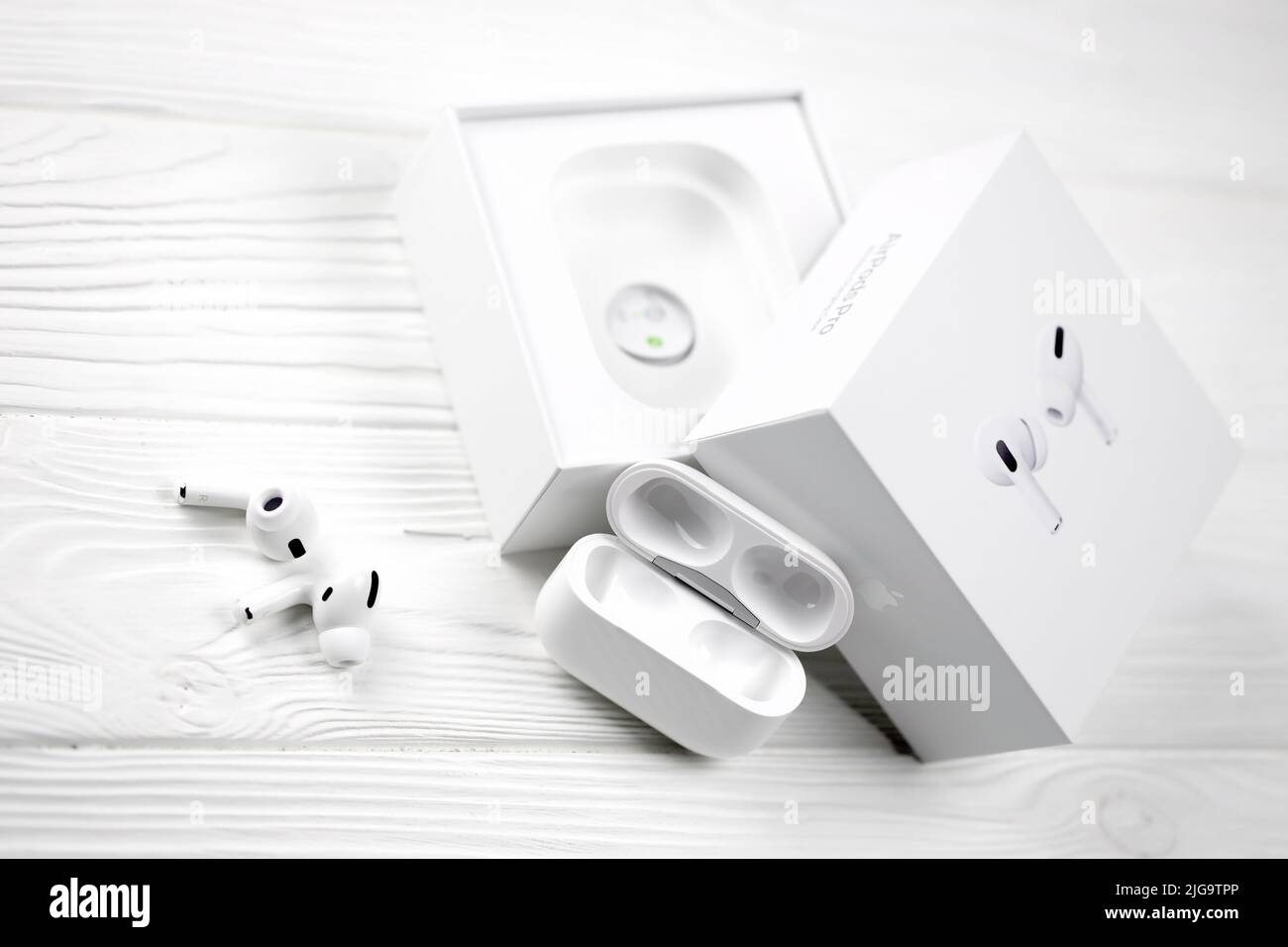 UKRAINE JANUARY 2021: Apple AirPods Pro on a white background. Wireless headphones with charging case and a box. Apple Inc. is an Ameri Stock Photo - Alamy