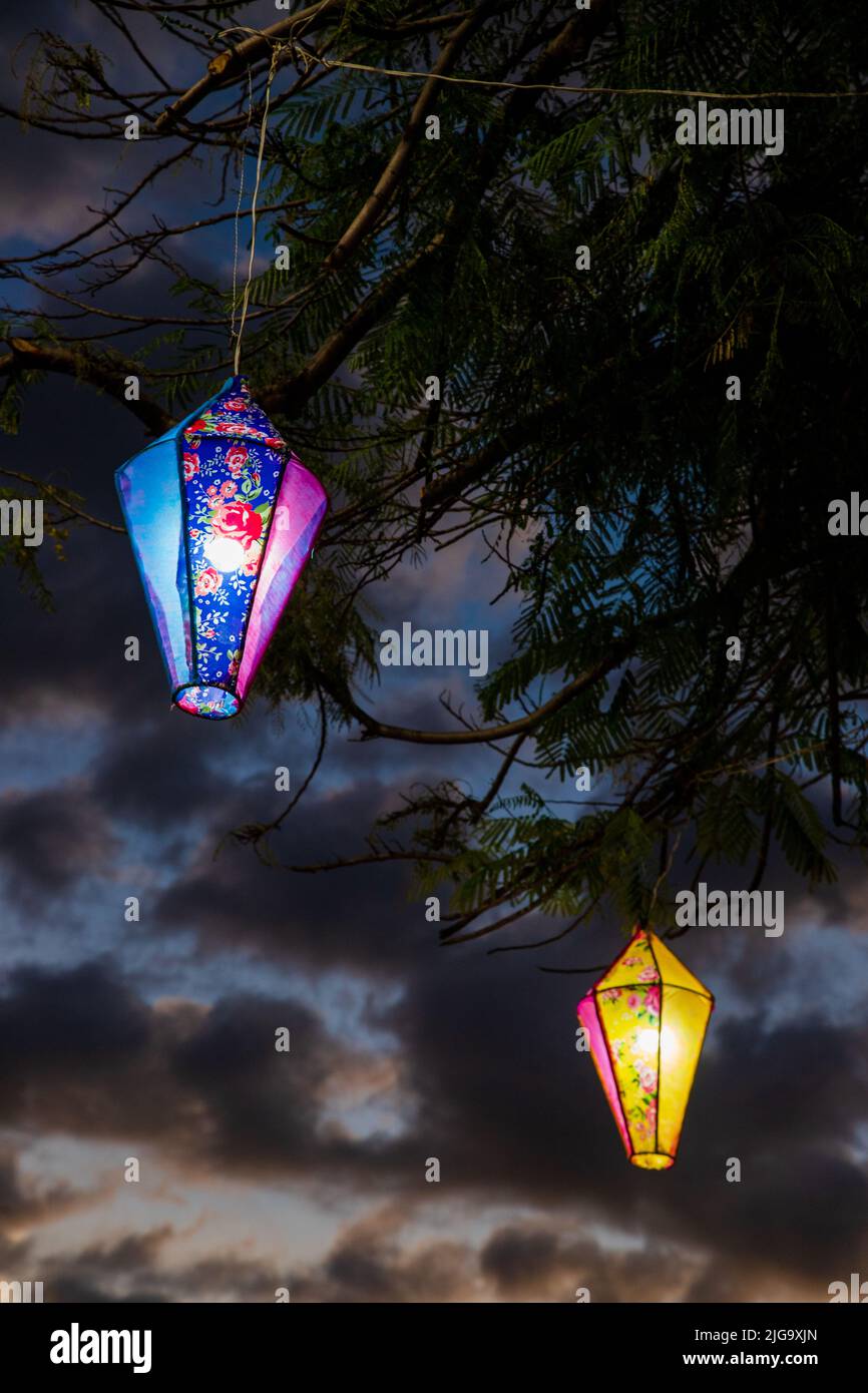 festa Junina decoration - illuminated balloons hanging from a tree Stock Photo