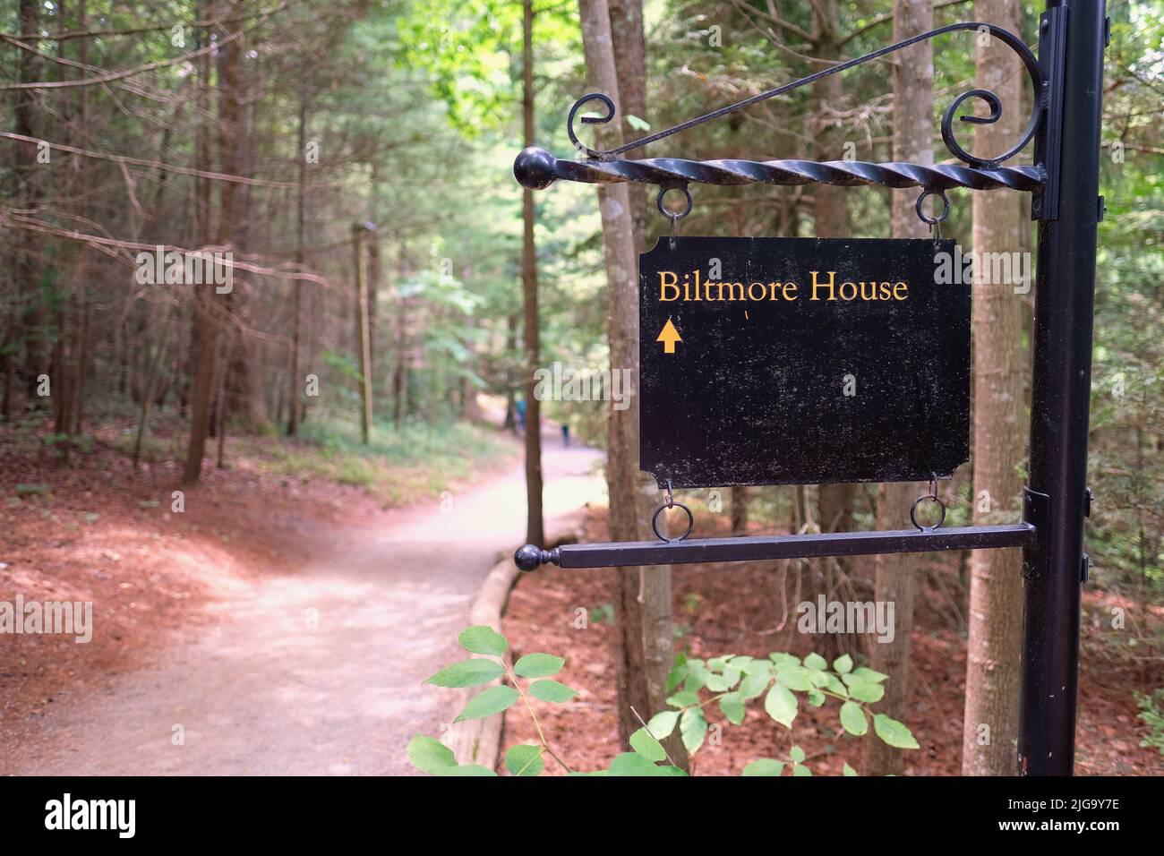 Sign on a path pointing towards the Biltmore House on the Biltmore Estate in Asheville, North Carolina, USA; mansion, museum, tourist attraction. Stock Photo