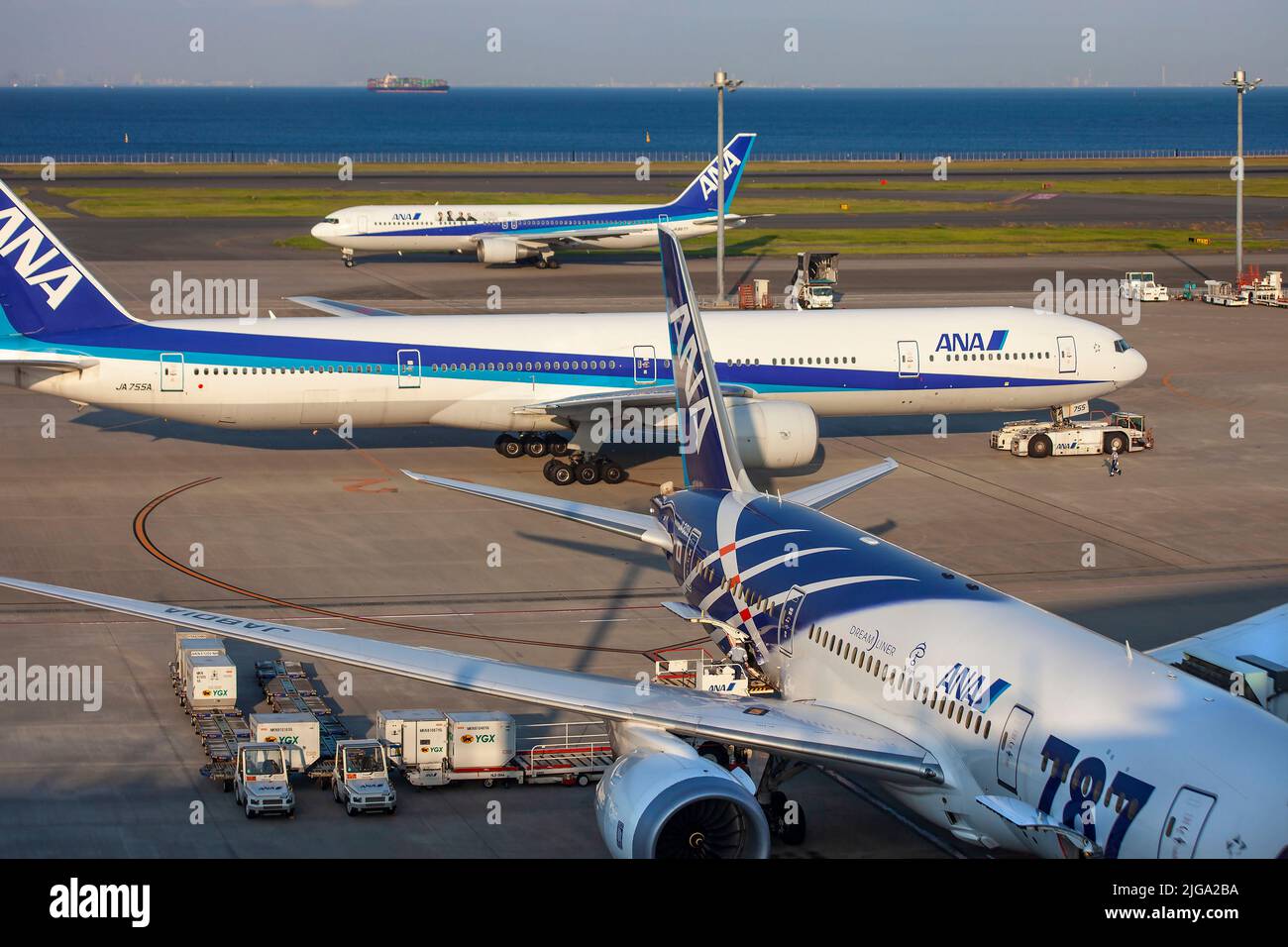 Airlines landing and taxiing into Haneda Airport in Tokyo, Japan Stock