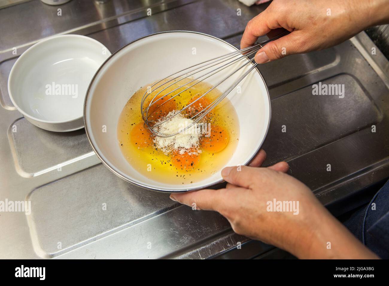 Beating eggs for cooking omelet in Nakaikegami, Tokyo, Japan Stock ...