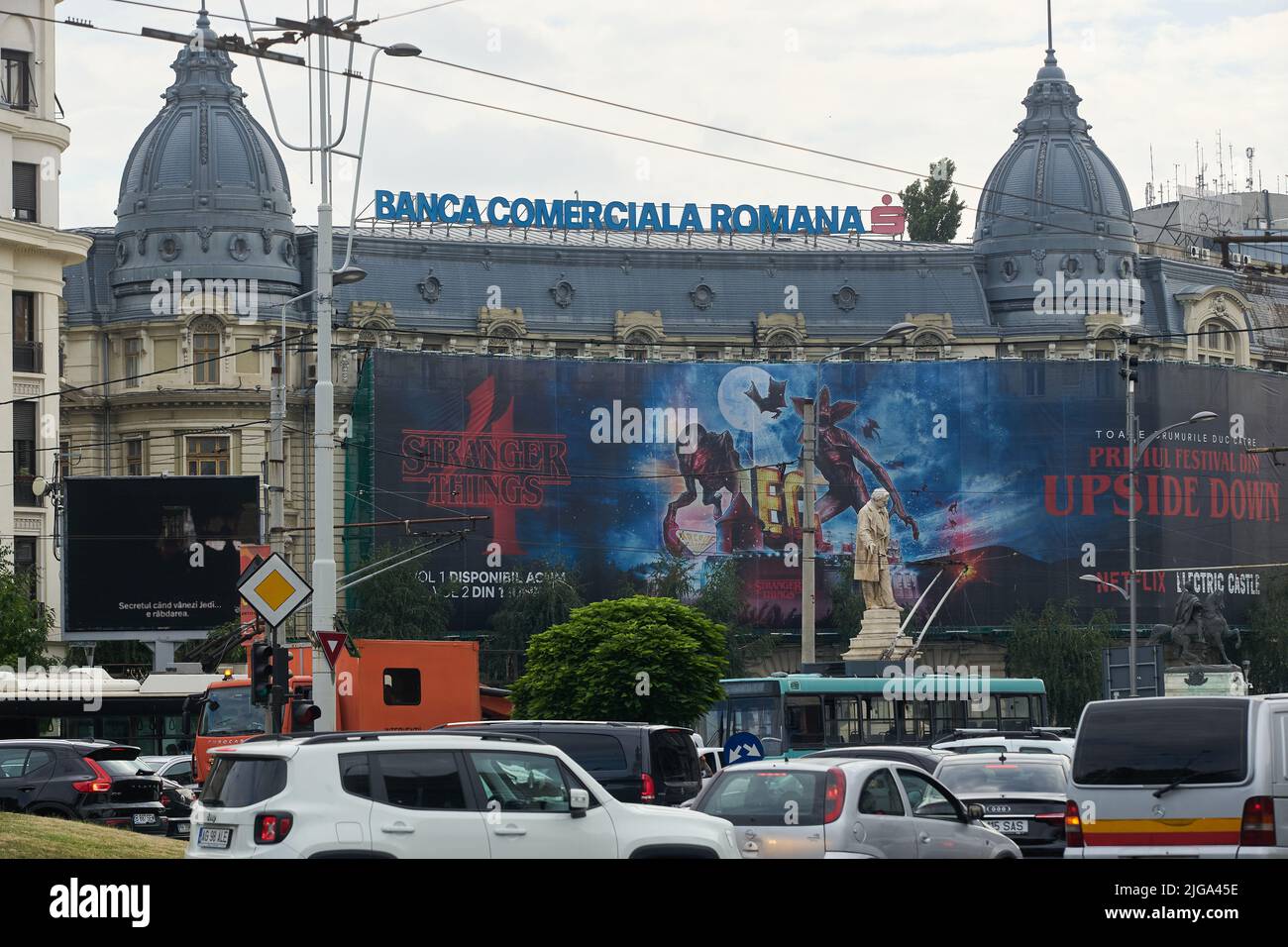 Bucharest, Romania - July 07, 2022: Extra large banner advertising Stranger Things season 4 displayed on Oscar Maugsch Palace, Romanian Commercial Ban Stock Photo