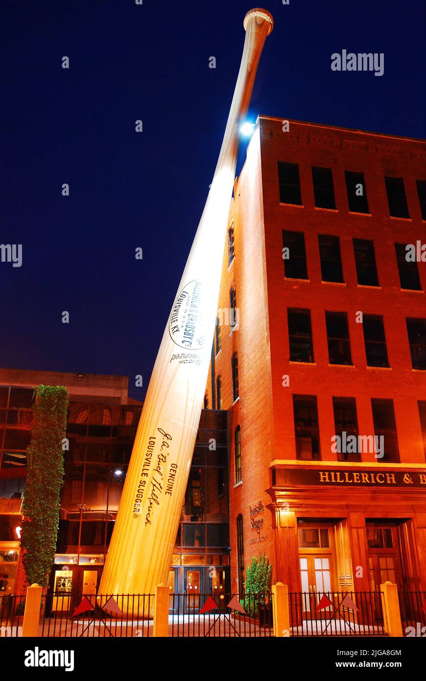 A large Louisville Slugger baseball bat leans against the sport equipment factory of Hillerich and Bradsby in downtown Louisville Kentucky Stock Photo