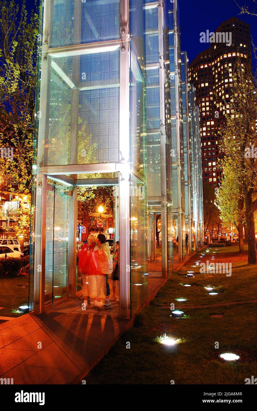 People walk through the five glass towers of the Boston Holocaust Memorial, honoring those killed by the Nazis in concentration camps Stock Photo