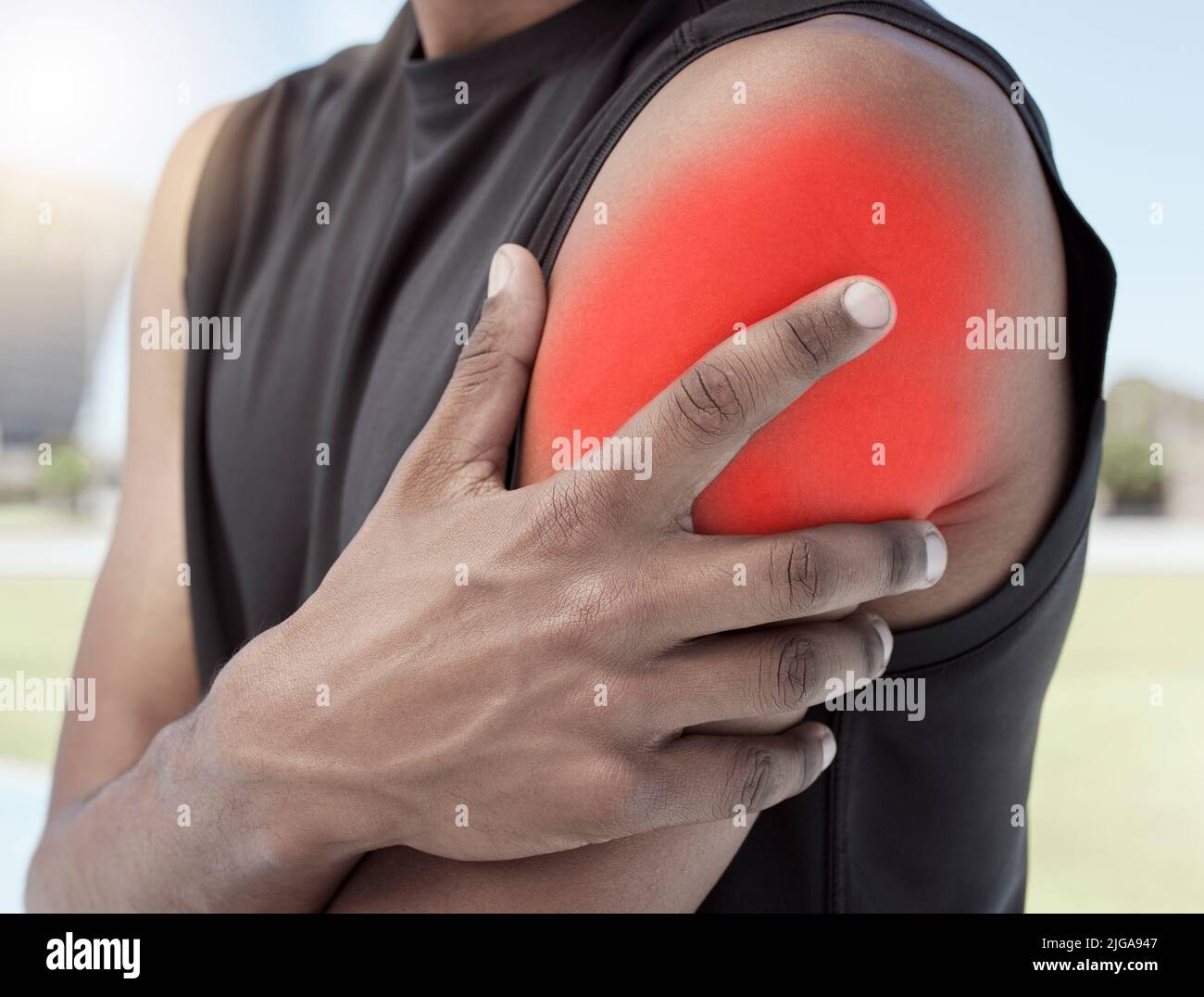Closeup of sports man suffering from an inflamed shoulder injury