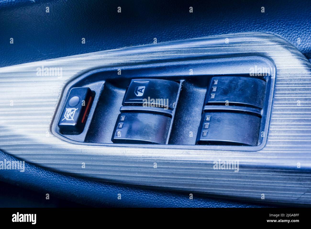 Multi function switch for central lock on door of a car. Interior doors of the car Stock Photo