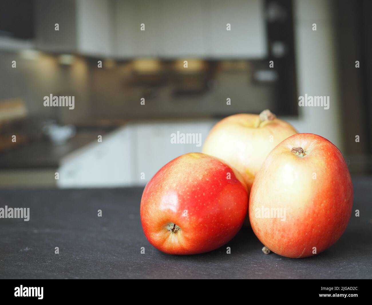 Ripe red apples on the table close-up. Stock Photo