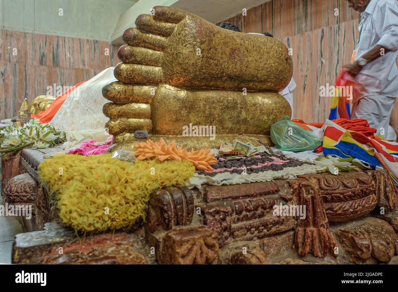 08 28 2008 Golden Buddha's foot at the temple Mahaparinirvana Kusinara or Kushinagar, Uttar Pradesh, India Stock Photo