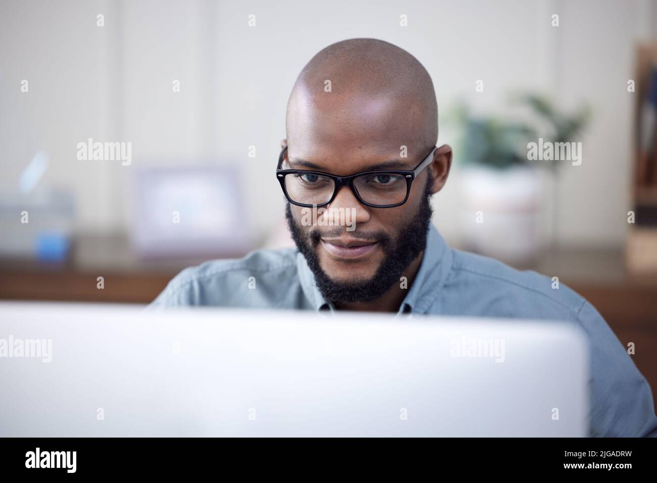 Success comes from persistence and hard work. a young businessman using ...