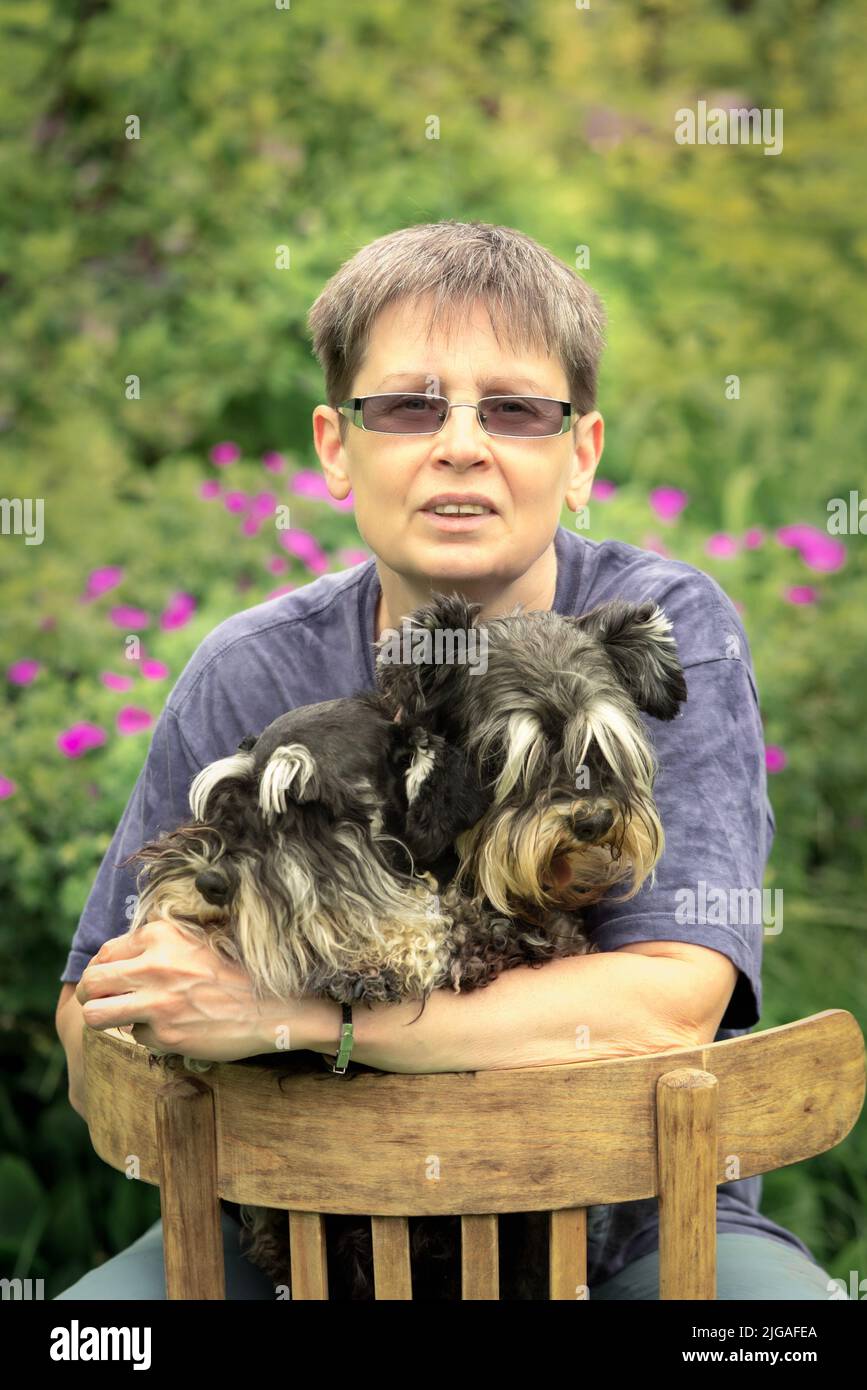 Portrait of a woman with two pets. Stock Photo