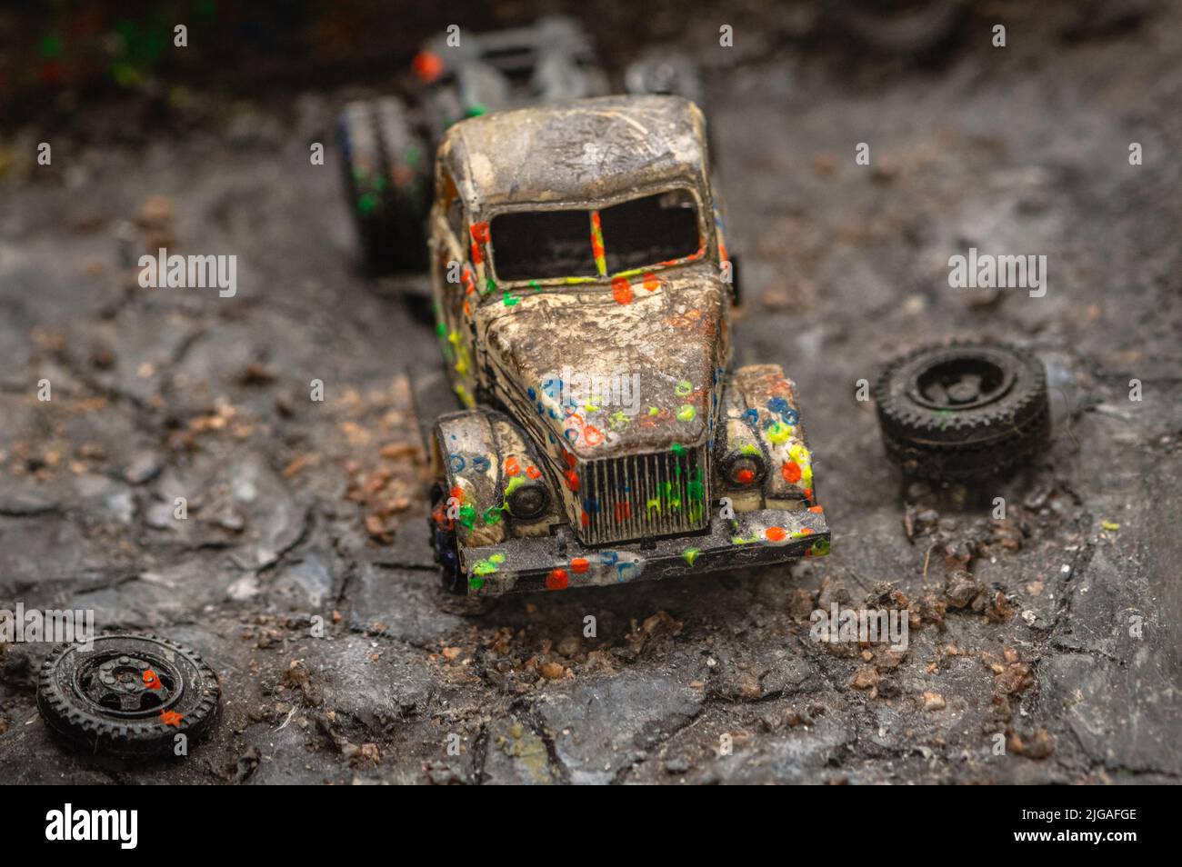 Toy representation of a rusty truck on the paintball site. Stock Photo