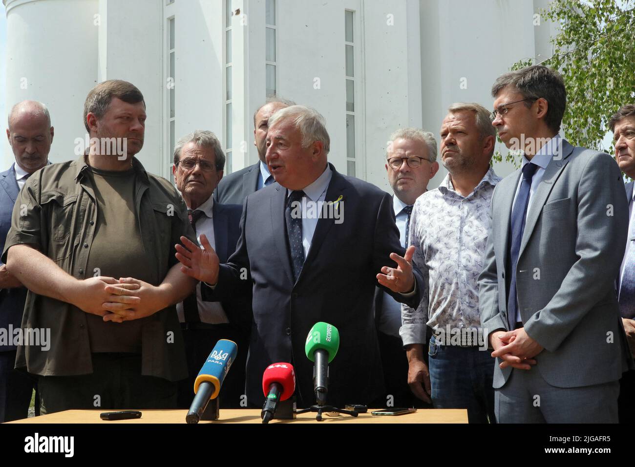 BUCHA, UKRAINE - JULY 8, 2022 - First Deputy Speaker of the Verkhovna Rada of Ukraine Oleksandr Korniienko, President of the Senate of the French Republic Gerard Larcher and Bucha city head Anatolii Fedoruk (L to R) attend a briefing outside the Church of Saint Andrew the First-Called Apostle and All Saints after the delegation of the upper house of the French Parliament got familiars with the consequences of the Russian occupation in Borodianka, Bucha and Irpin, Bucha, Kyiv Region, northern Ukraine. Photo by Pavlo Bagmut/Ukrinform/ABACAPRESS.COM Stock Photo