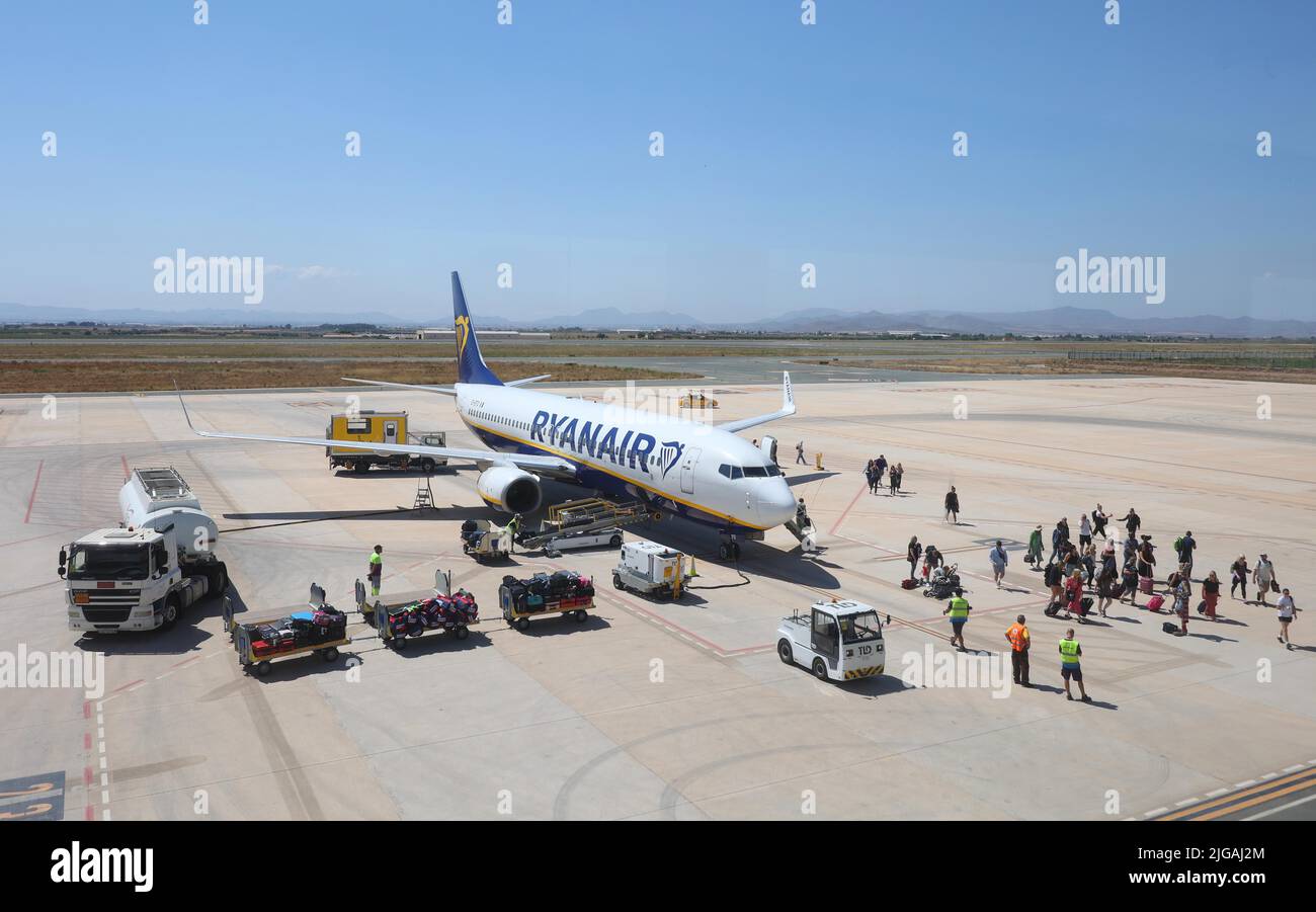 Passengers disembark a Boeing 737-8AS(WL)  Ryanair Charter Plane at Mercia Airport in Spain. Stock Photo