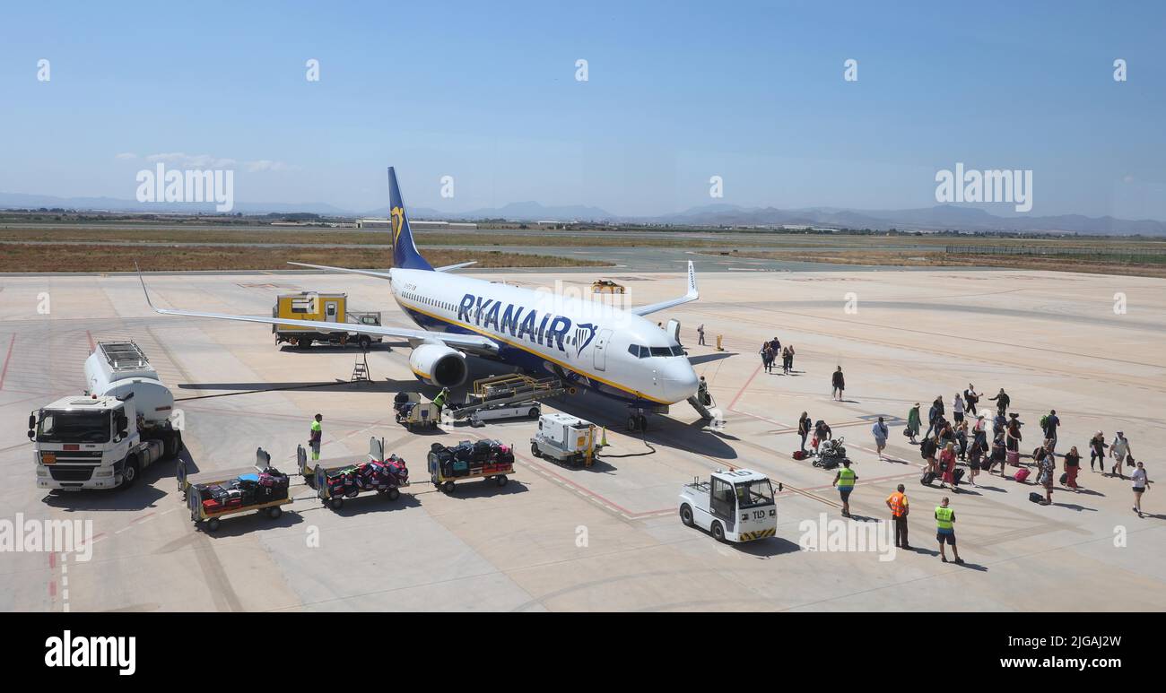 Passengers disembark a Boeing 737-8AS(WL)  Ryanair Charter Plane at Mercia Airport in Spain. Stock Photo