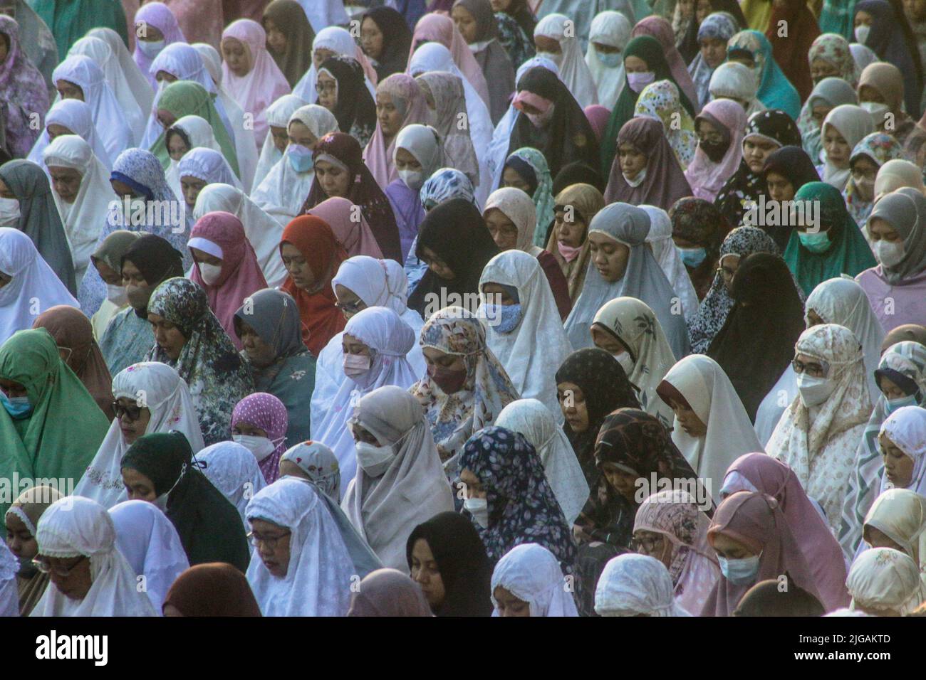 Indonesian Muslims perform Eid al-Adha prayers at Sempur field in Bogor, Indonesia on July 9, 2022. Stock Photo