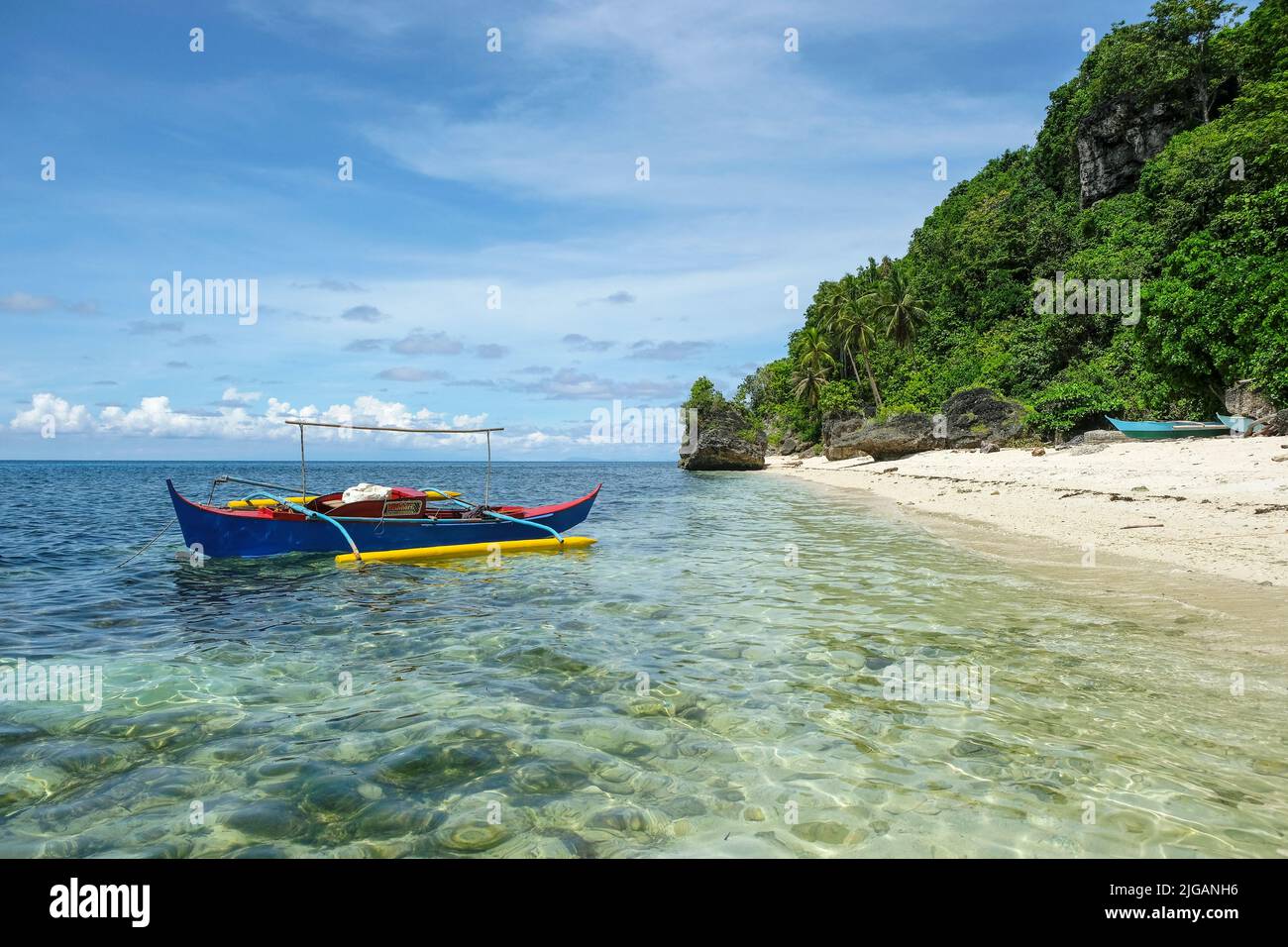Siquijor, Philippines - June 2022: Fishing boat at Monkey Beach on Siquijor Island on June 22, 2022 in Siquijor island, Philippines. Stock Photo