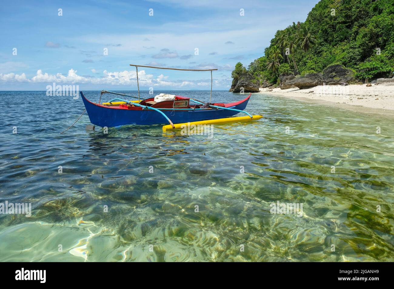 Siquijor, Philippines - June 2022: Fishing boat at Monkey Beach on Siquijor Island on June 22, 2022 in Siquijor island, Philippines. Stock Photo
