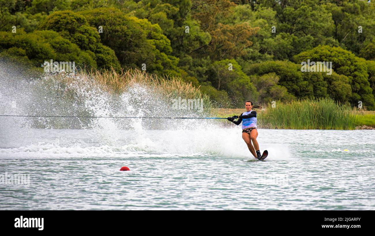Mulwala, New South Wales Australia - 3 April 2022: Woman slalom skier about to round a buoy in the Australian Championships at Mulwala Stock Photo