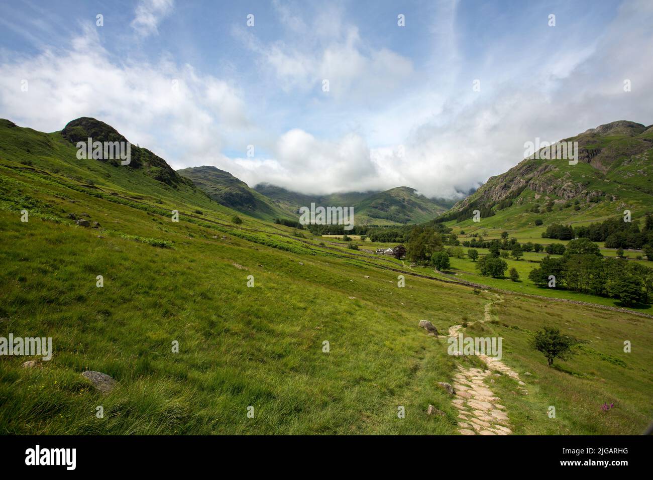 A summer view across a valley n the Lake District, Cumbria, UK Stock