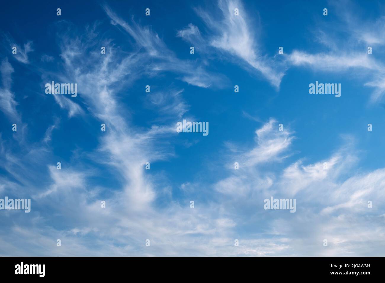 Summer blue sky, cirrus clouds, gradient light white background. Sunny air background. Blue landscape in the environment. Stock Photo