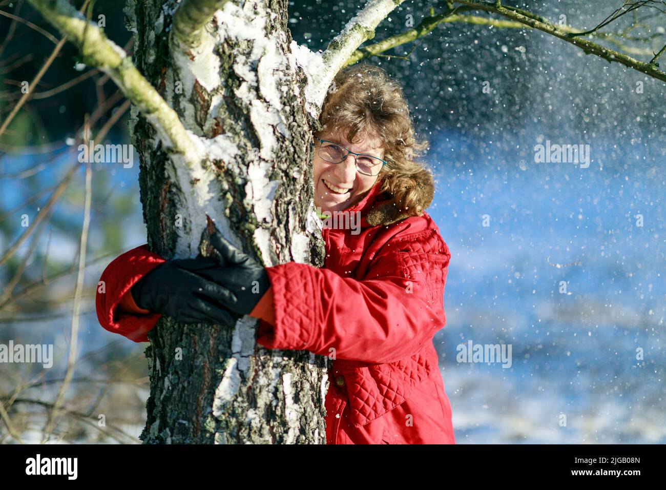Cheerful woman enjoying the winter in the polish forest. Poland. Europe Stock Photo