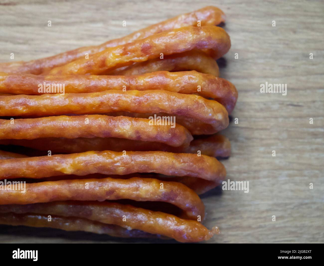 Traditional Polish sausages Kabanos on a wooden surface, macro photo ...