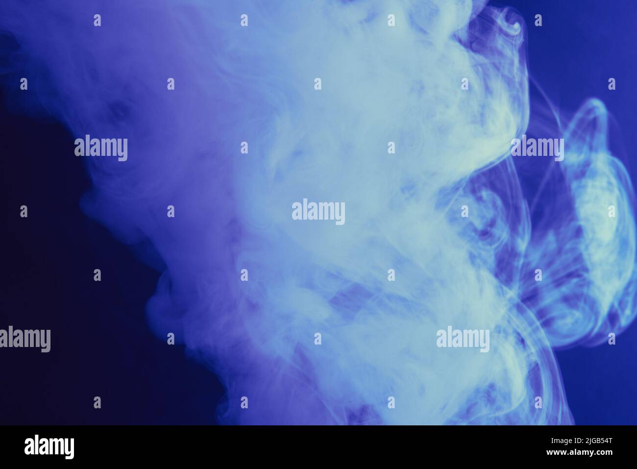 blue smoke on a dark background Stock Photo - Alamy