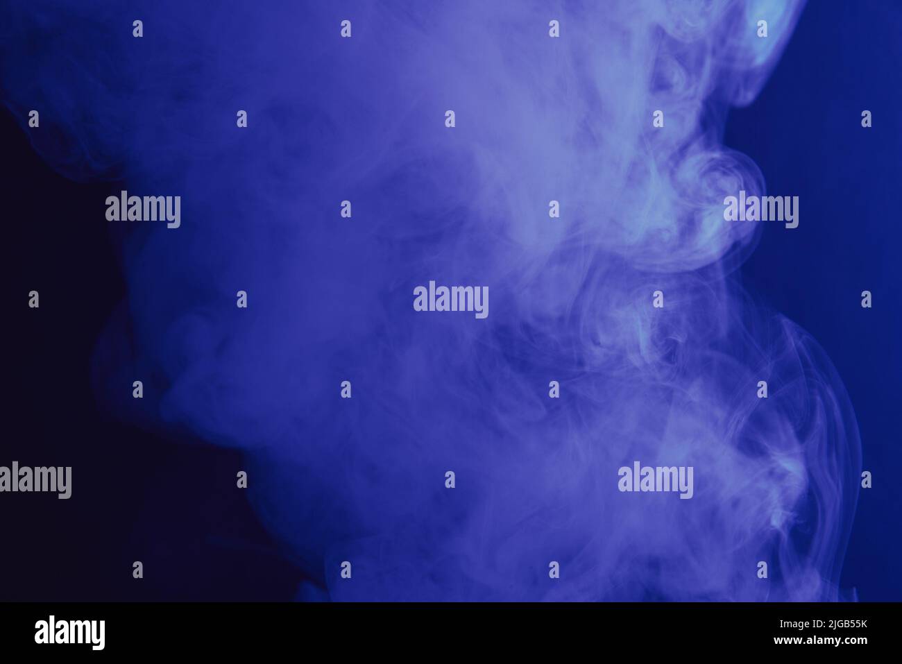 blue smoke on a dark background Stock Photo - Alamy