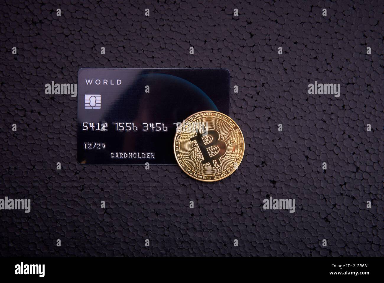 Bitcoin with credit card on black table background. Cryptocurrency  accepting for payment concept. Buy bitcoins online using credit or debit  card. 3d r Stock Photo - Alamy
