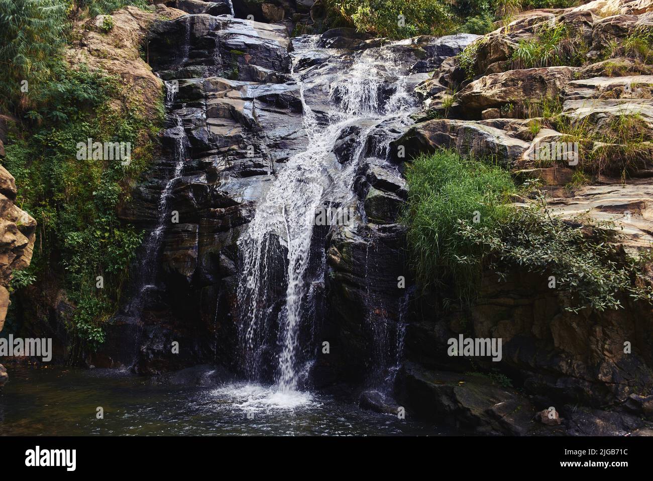 The Ravana Falls  is a popular sightseeing attraction in Sri Lanka. Stock Photo