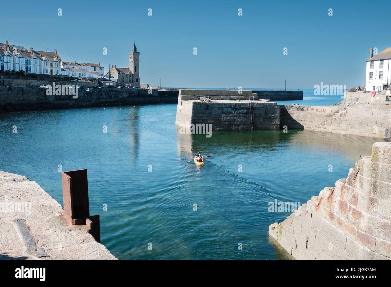 Kayak leaving harbour in Porthleven, Cornwall Stock Photo Alamy