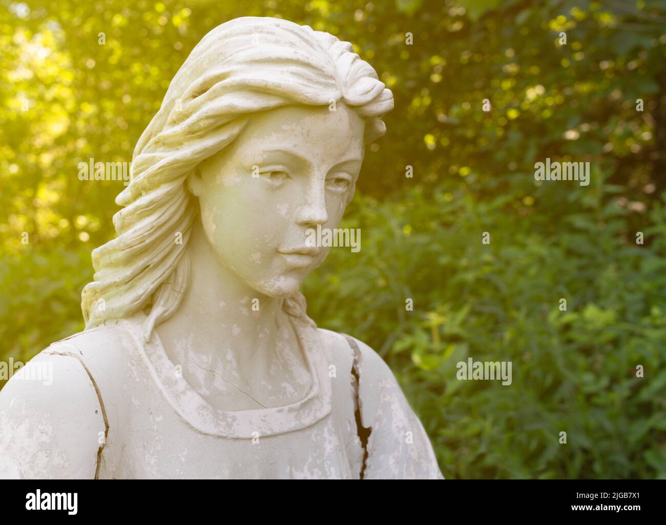 Angel statue headshot portrait with light flare Stock Photo