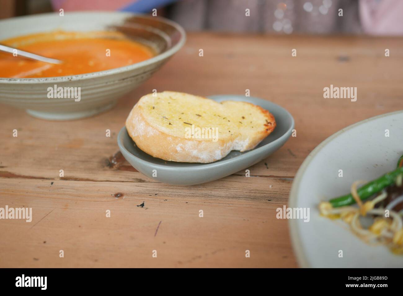 garlic bread , soup on a table Stock Photo Alamy