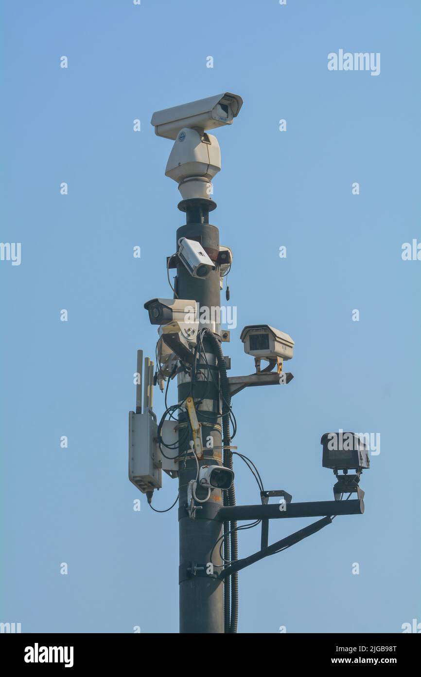An array of Chinese security cameras cover 360 degrees of surveillance on the people in China. Stock Photo