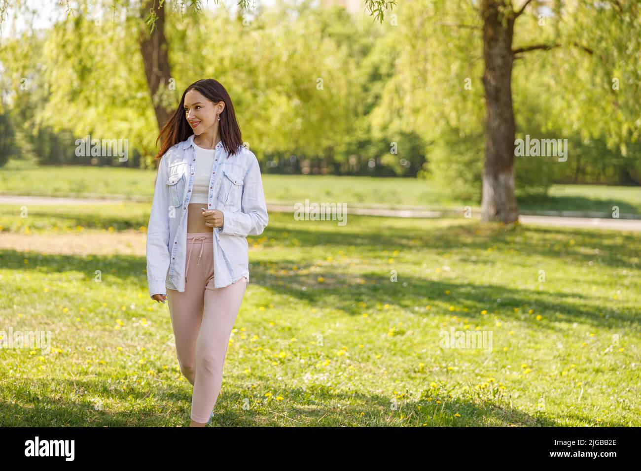 Smiled caucasian woman walking park hi-res stock photography and images ...