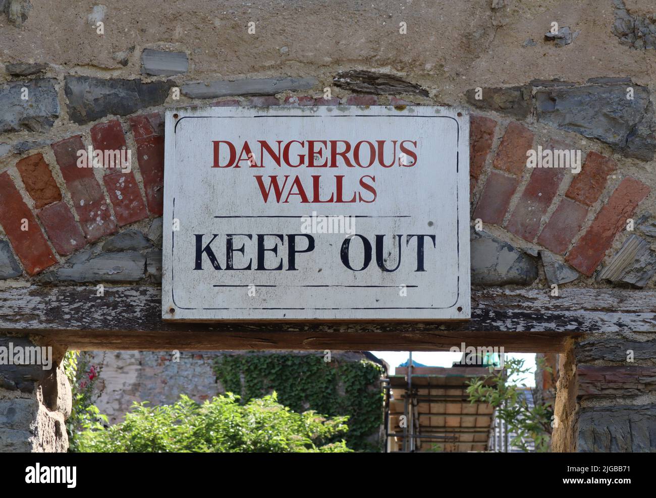 A sign of a derelict building on the outskirts of Kilve in Somerset telling people to keep out