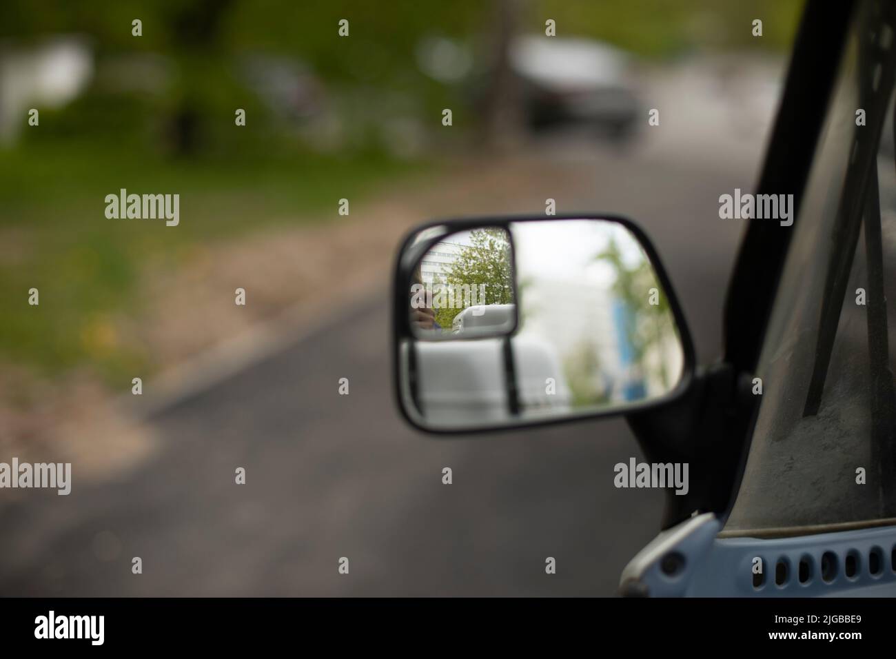 Rearview mirror of car. Mirror to monitor road. Observation tool. Old