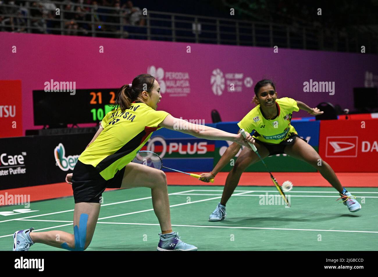 Malaysia's Thinaah Muralitharan and Pearly Tan use three languages to communicate on the badminton court