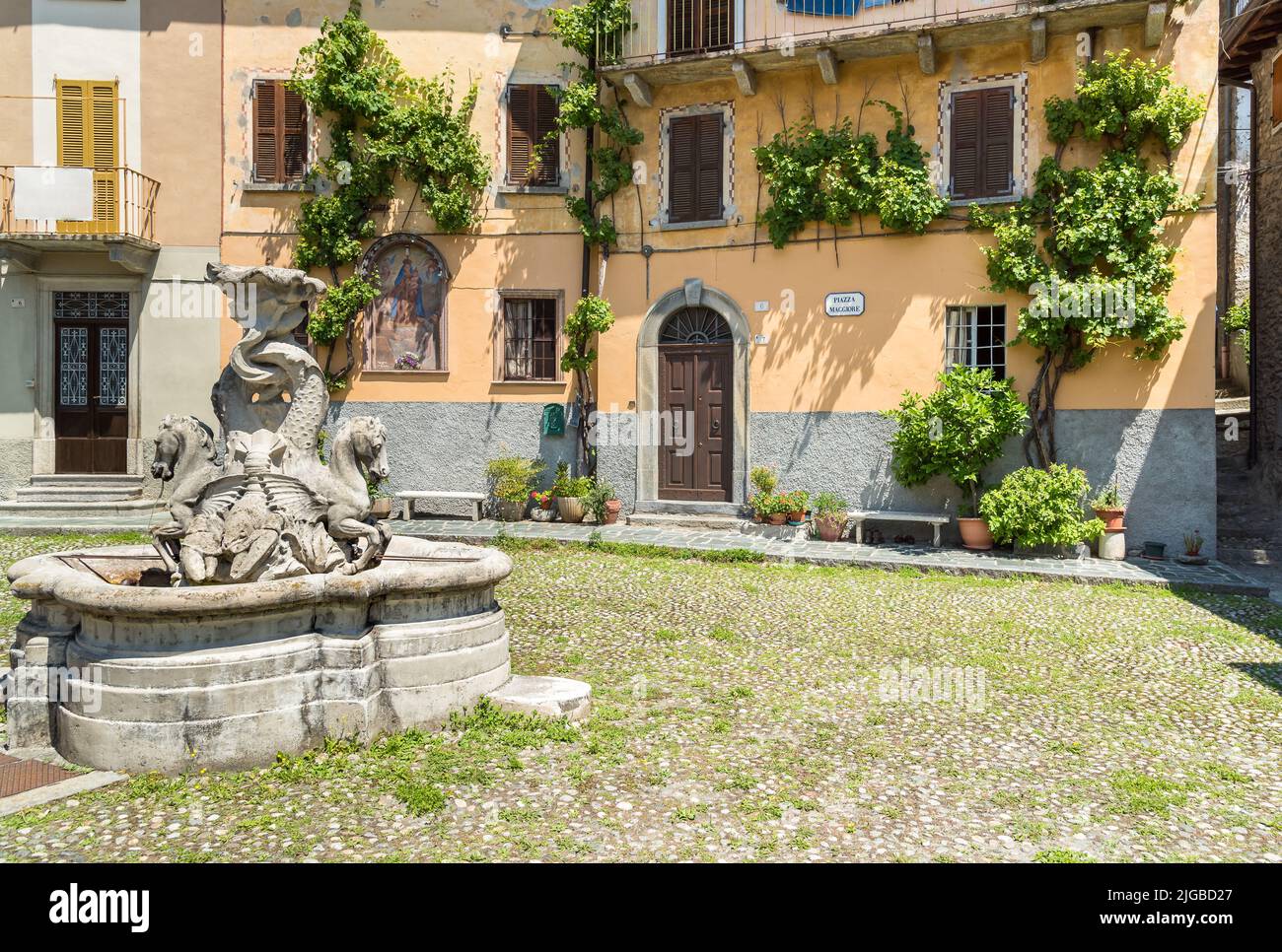The fountain on the square in the small ancient village Naggio in the province of Como, Lombardy, Italy Stock Photo