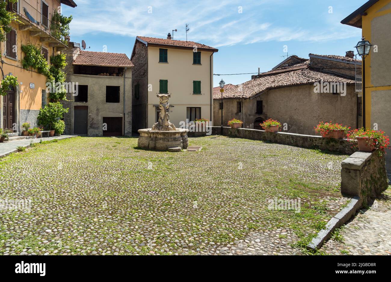 The square with the fountain in the small ancient village Naggio in the province of Como, Lombardy, Italy Stock Photo