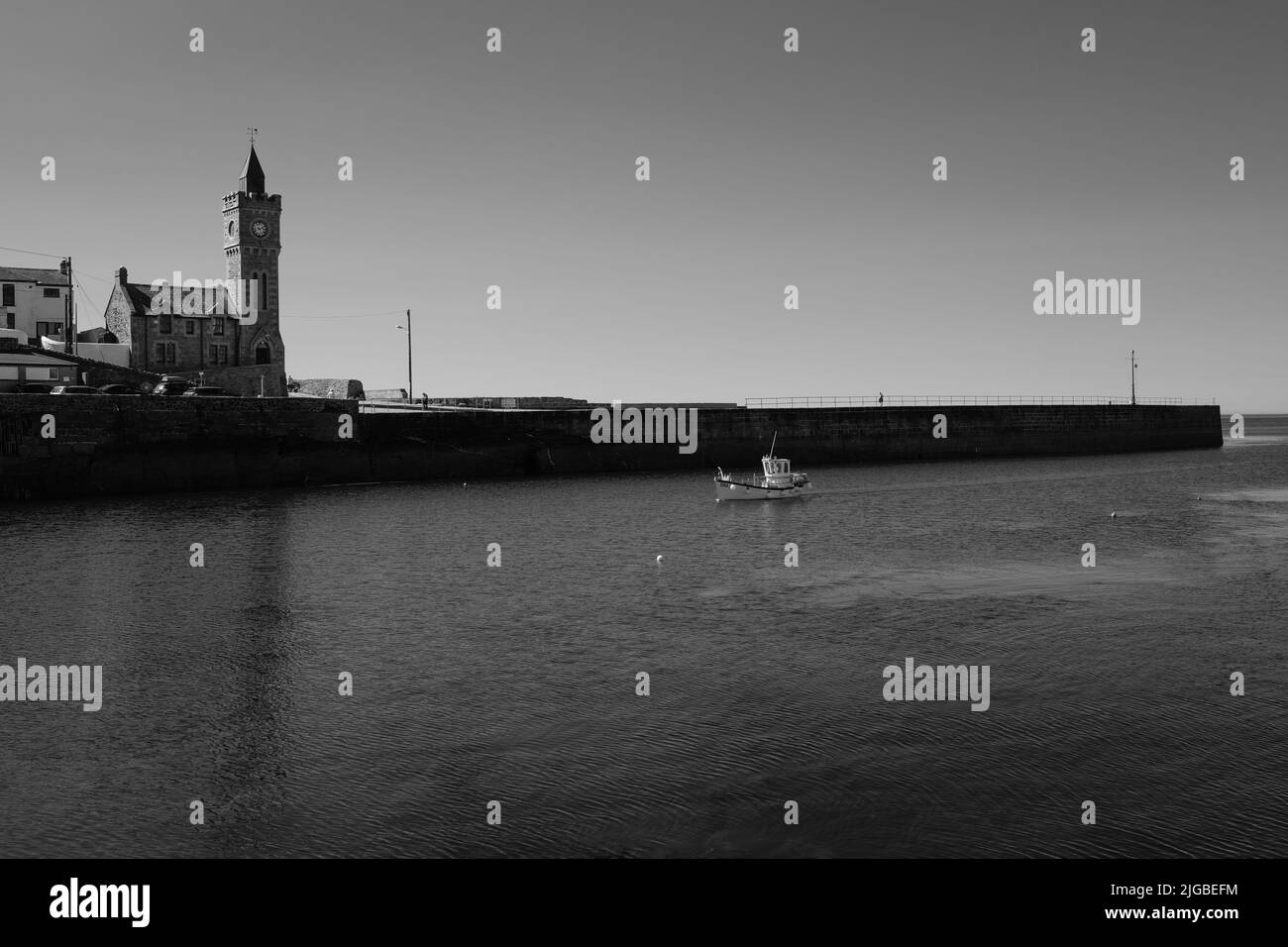 Boats leaving Porthleven Harbour, Cornwall Stock Photo