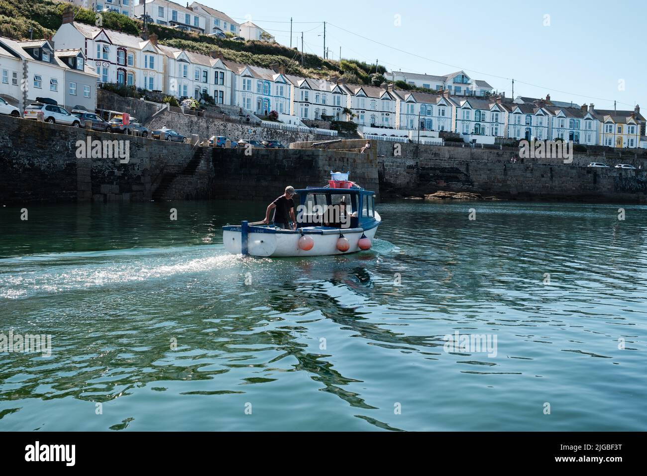 Boats leaving Porthleven Harbour, Cornwall Stock Photo Alamy