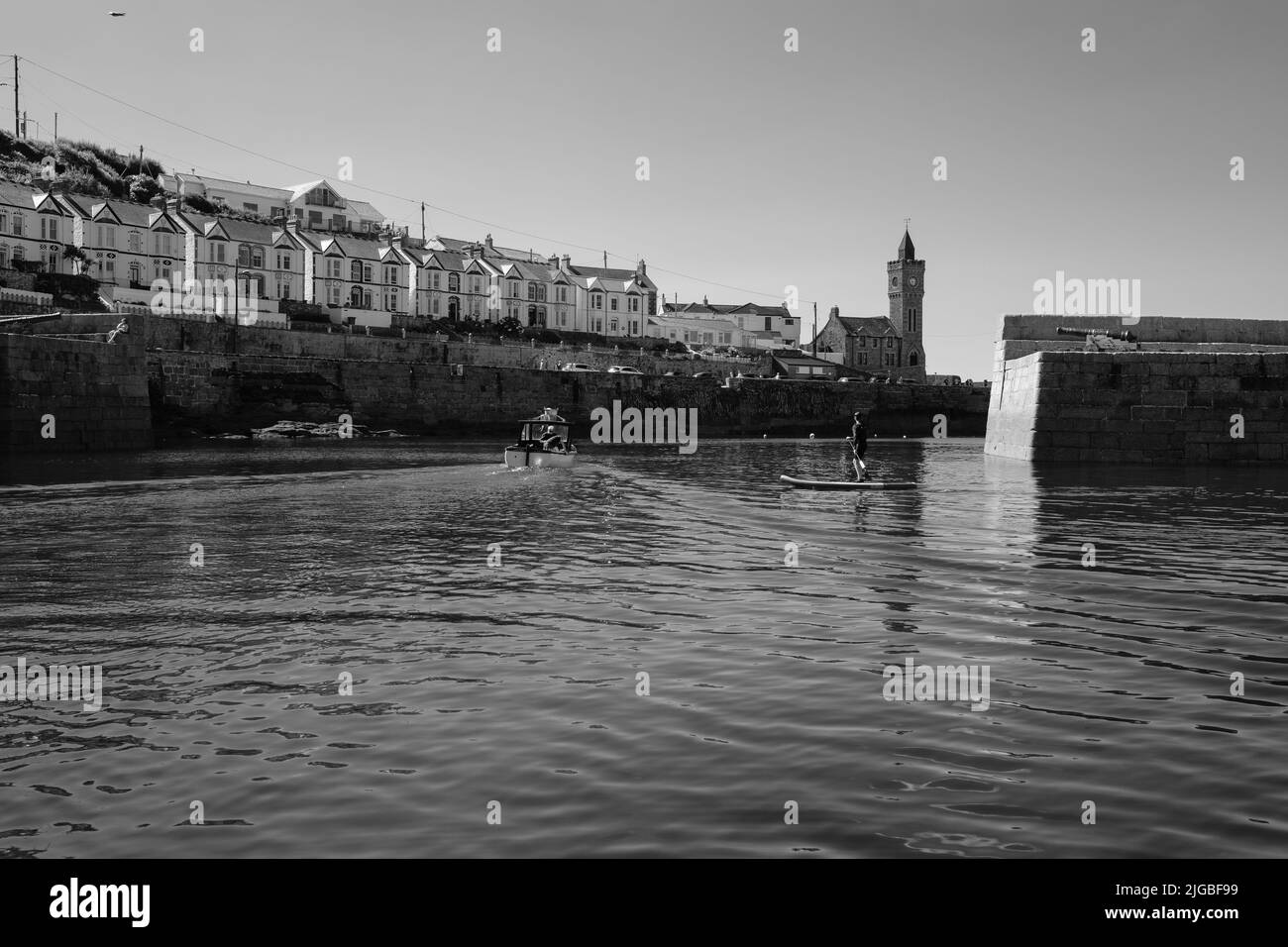 Boats leaving Porthleven Harbour, Cornwall Stock Photo