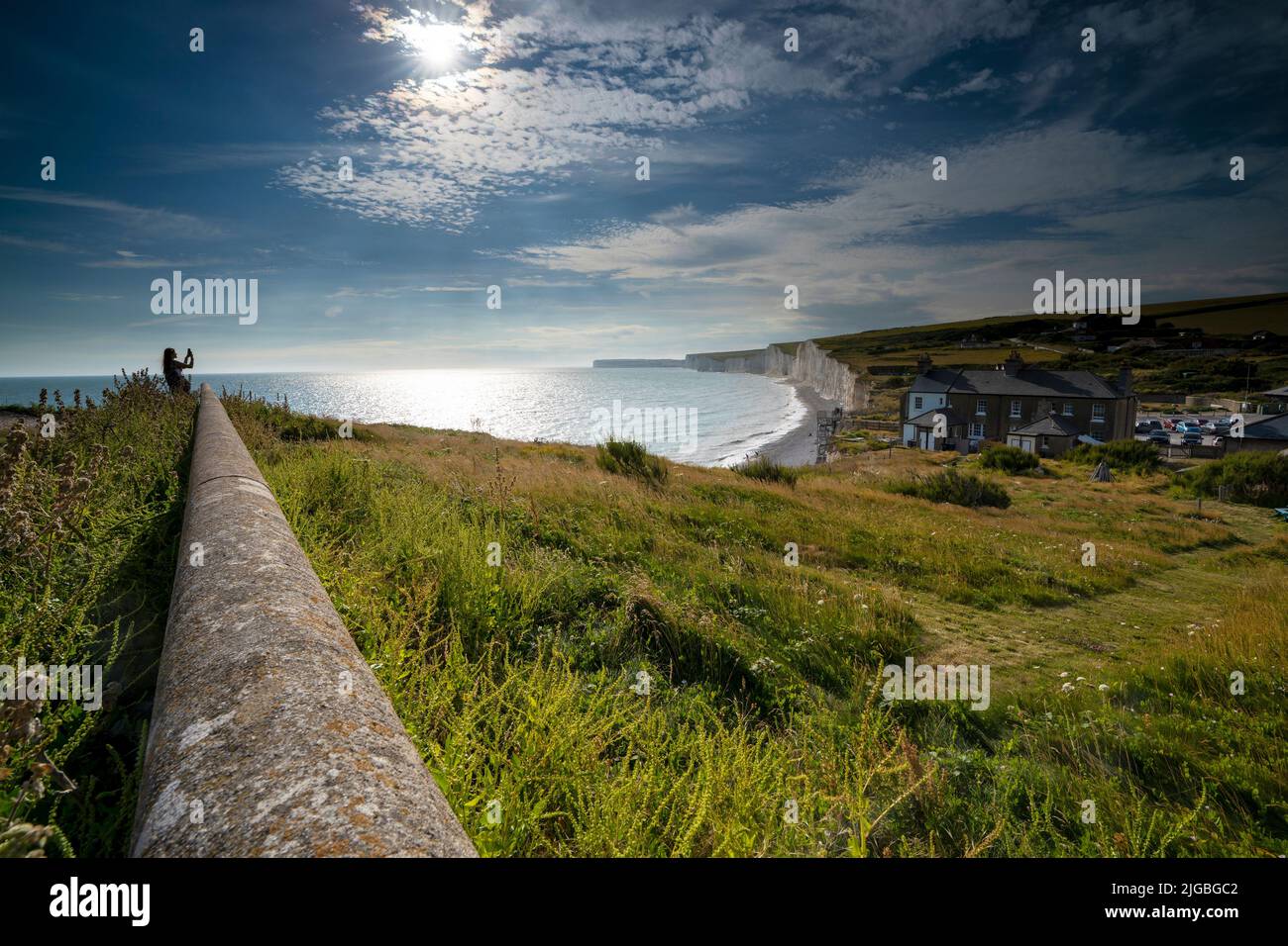 Girl photographs the Seven Sisters at Birling Gap  on the South Downs National Park, Eastbourne, East Sussex, England, Uk, Gb Stock Photo