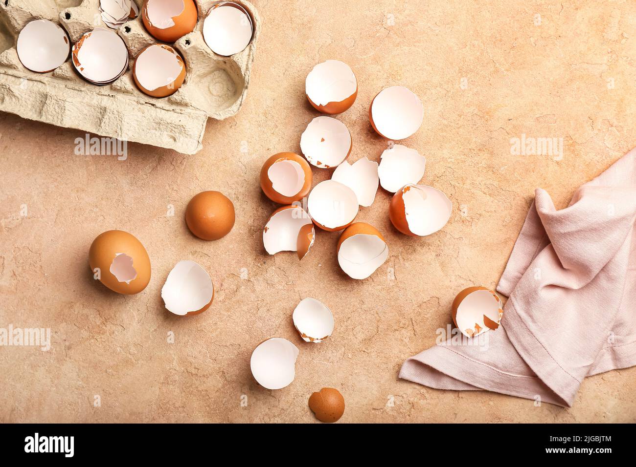 Composition with broken egg shells on color background Stock Photo