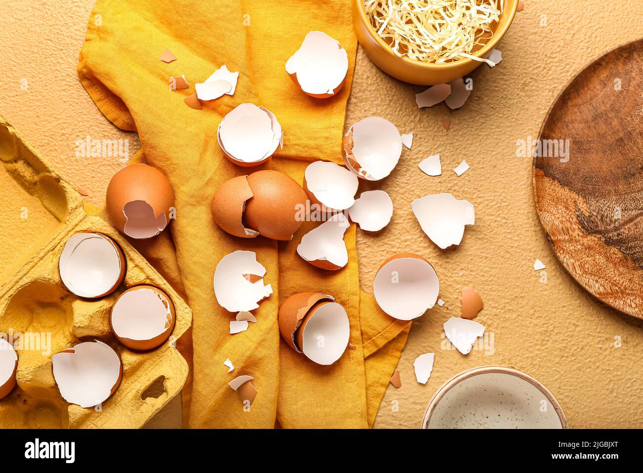 Composition with broken egg shells on color background Stock Photo